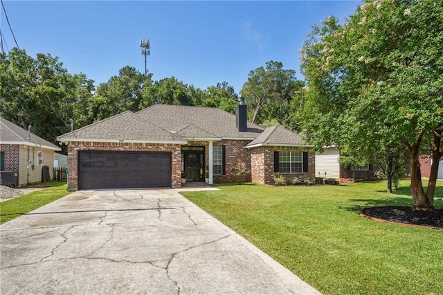 1400 Viola St, Mandeville, LA 70448 - view of front of house featuring a garage, concrete driveway, a front lawn, a chimney, and brick siding