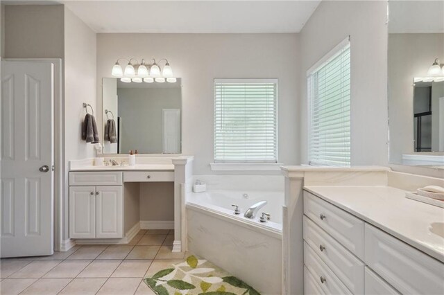 1400 Viola St, Mandeville, LA 70448 - bathroom with plenty of natural light, a bath, two vanities, and tile patterned floors