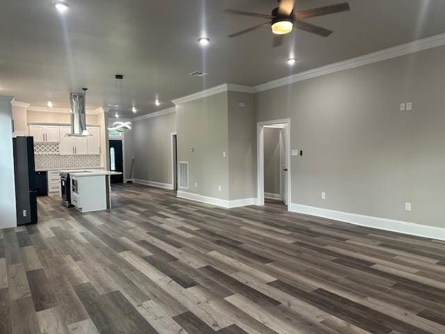 1731 Pratt Dr, New Orleans, LA 70122 - unfurnished living room with a ceiling fan, baseboards, ornamental molding, and dark wood finished floors