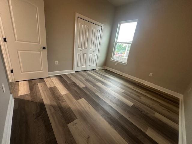 1731 Pratt Dr, New Orleans, LA 70122 - unfurnished bedroom featuring wood finished floors, baseboards, and a closet