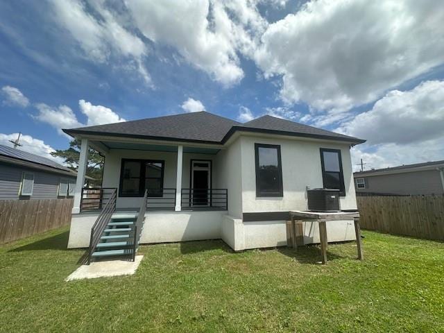 1731 Pratt Dr, New Orleans, LA 70122 - back of house with covered porch, stucco siding, cooling unit, roof with shingles, and stairway