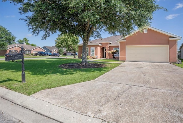 39070 Pirogue Ave, Gonzales, LA 70737 - ranch-style home featuring stucco siding, a garage, a front lawn, and concrete driveway