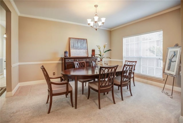 39070 Pirogue Ave, Gonzales, LA 70737 - dining space featuring a chandelier, light carpet, crown molding, and baseboards