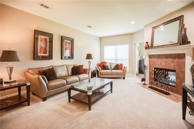 39070 Pirogue Ave, Gonzales, LA 70737 - carpeted living room featuring a tiled fireplace, recessed lighting, and baseboards