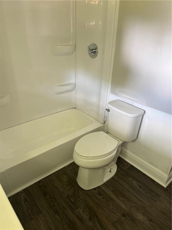 611 E Michigan St, Hammond, LA 70401 - bathroom featuring wood finished floors, toilet, and  shower combination