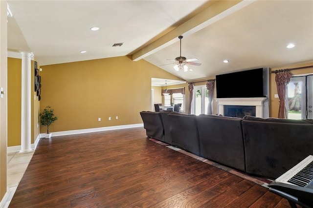 1825 Lake Superior Dr, Harvey, LA 70058 - living area with ornate columns, hardwood / wood-style floors, a fireplace, plenty of natural light, and recessed lighting