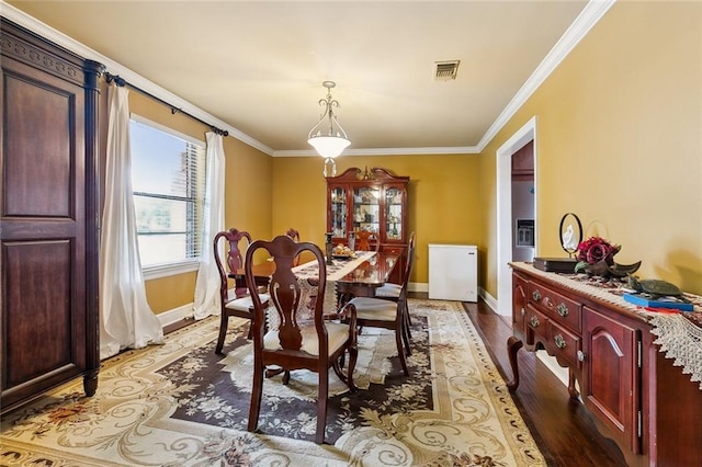 1825 Lake Superior Dr, Harvey, LA 70058 - dining area featuring baseboards, ornamental molding, and wood finished floors