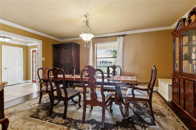 1825 Lake Superior Dr, Harvey, LA 70058 - dining space with crown molding, baseboards, and light tile patterned floors