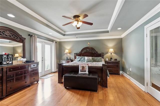 1825 Lake Superior Dr, Harvey, LA 70058 - bedroom with a tray ceiling, access to exterior, light wood-style floors, french doors, and ornamental molding