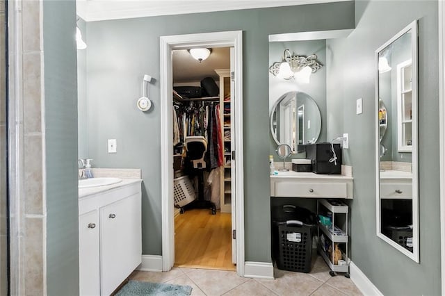 1825 Lake Superior Dr, Harvey, LA 70058 - full bathroom with tile patterned flooring, vanity, a walk in closet, and baseboards