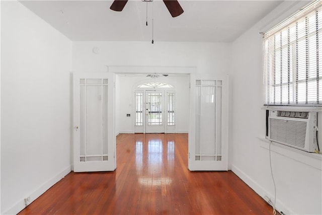 233537 Jasmine St, New Orleans, LA 70122 - hall featuring wood finished floors, baseboards, french doors, and cooling unit