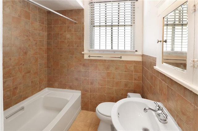 233537 Jasmine St, New Orleans, LA 70122 - bathroom featuring tile walls, a sink, tub / shower combination, toilet, and tile patterned floors