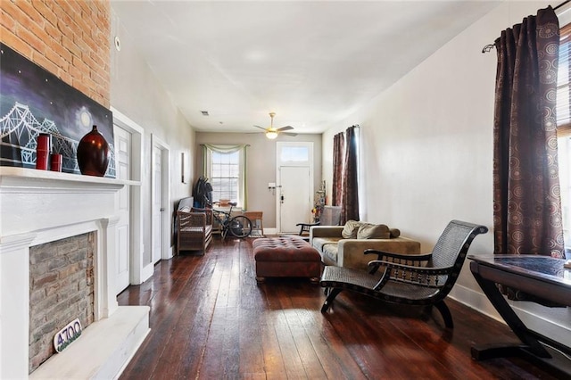 719 Atlantic Ave, New Orleans, LA 70114 - living area with a fireplace with raised hearth, wood-type flooring, ceiling fan, and baseboards