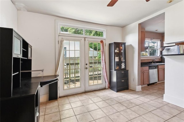 719 Atlantic Ave, New Orleans, LA 70114 - doorway to outside featuring ceiling fan, light tile patterned floors, french doors, and a sink