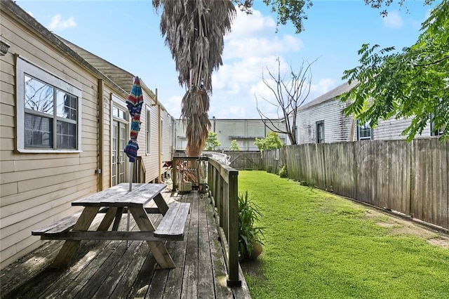 719 Atlantic Ave, New Orleans, LA 70114 - view of yard with a wooden deck and outdoor dining space