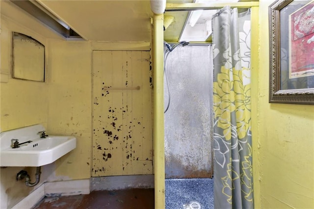 1311 Bourbon St, New Orleans, LA 70116 - full bathroom with curtained shower and a sink
