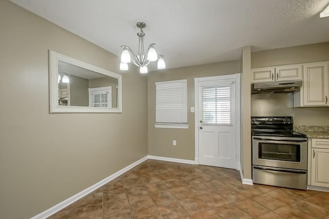 103 Omega St Unit B, Belle Chasse, LA 70037 - kitchen featuring electric range, under cabinet range hood, a chandelier, baseboards, and light countertops