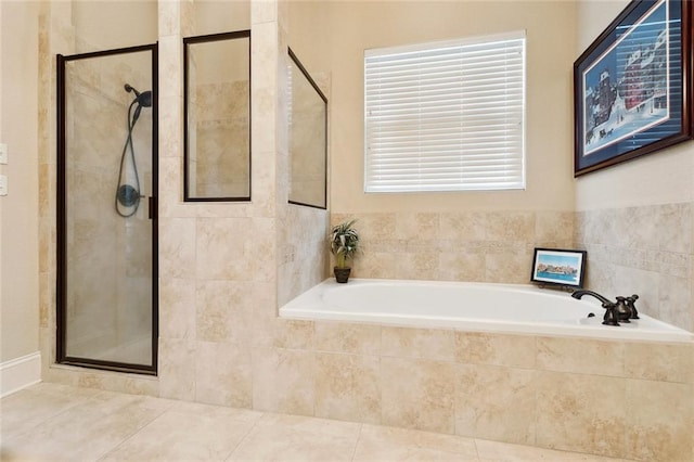 full bathroom with a shower stall, a garden tub, and tile patterned flooring