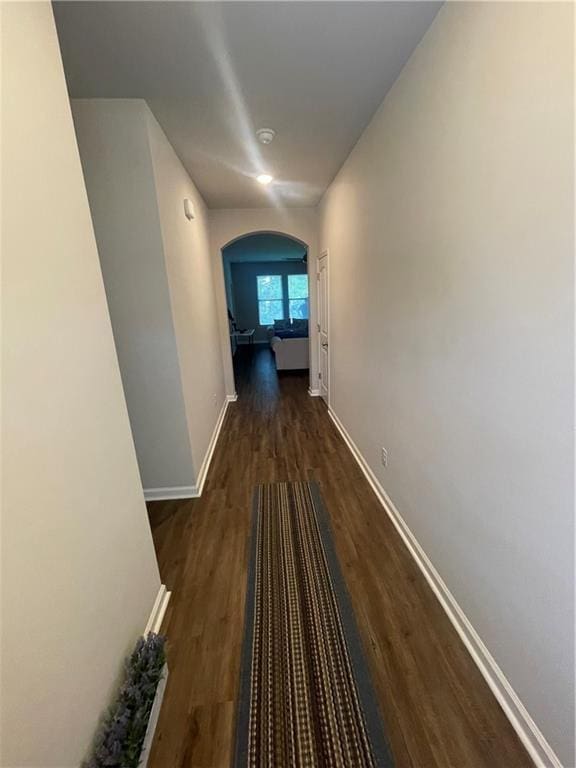 47715 Cathy Ln, Robert, LA 70455 - corridor with wood finished floors, arched walkways, and baseboards