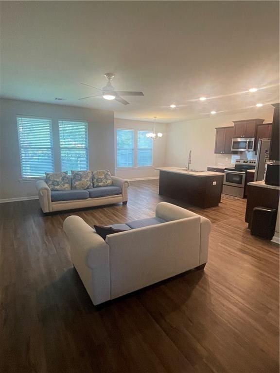 47715 Cathy Ln, Robert, LA 70455 - living room featuring baseboards, wood finished floors, a chandelier, recessed lighting, and ceiling fan