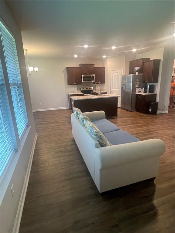 47715 Cathy Ln, Robert, LA 70455 - living room featuring baseboards, a chandelier, dark wood-style floors, and recessed lighting