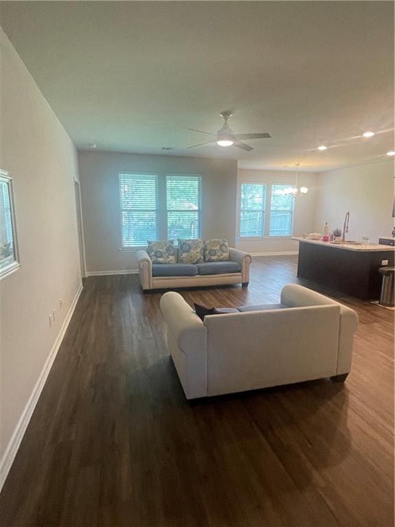 47715 Cathy Ln, Robert, LA 70455 - living room featuring baseboards, a chandelier, dark wood-type flooring, recessed lighting, and a ceiling fan