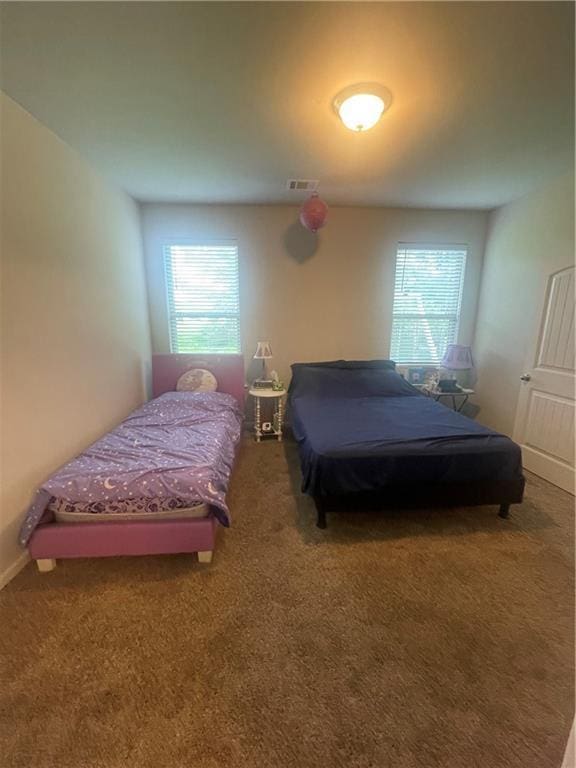 47715 Cathy Ln, Robert, LA 70455 - bedroom with multiple windows, carpet flooring, and baseboards