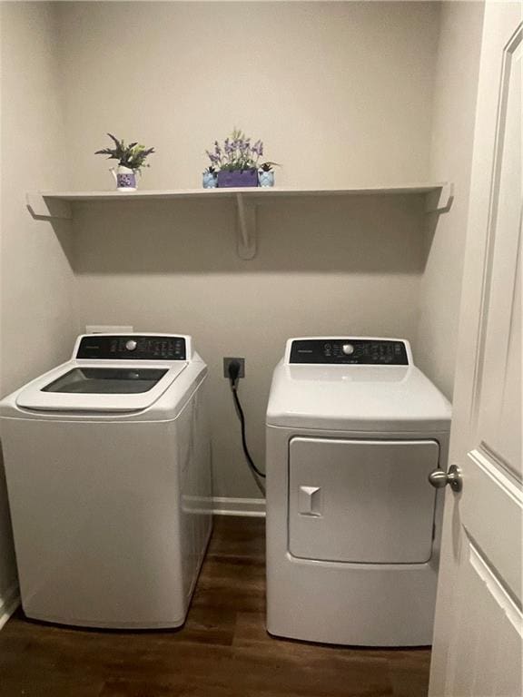 47715 Cathy Ln, Robert, LA 70455 - laundry area featuring washing machine and dryer, dark wood-style flooring, and baseboards
