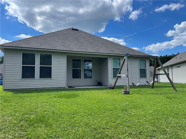 47715 Cathy Ln, Robert, LA 70455 - rear view of house with roof with shingles and a yard