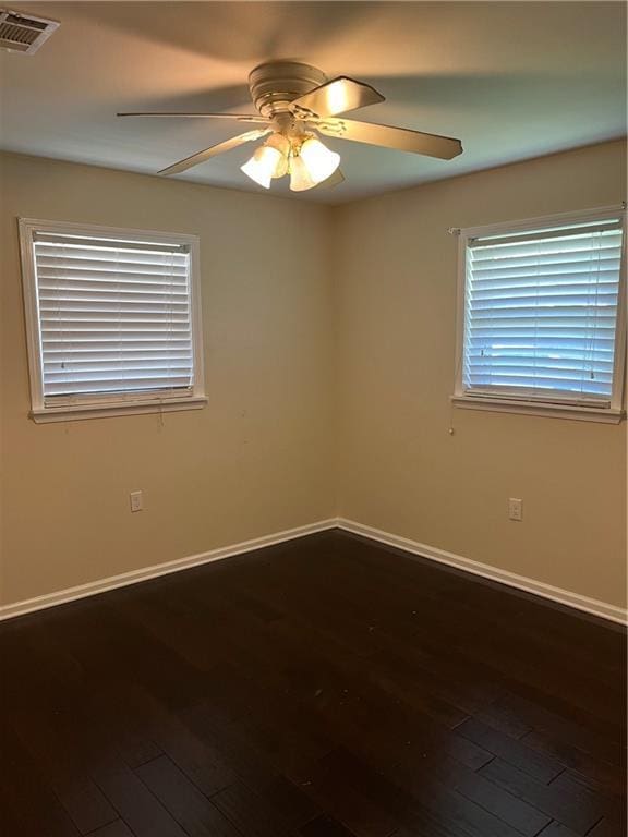 213 4th St, Chalmette, LA 70043 - unfurnished room with ceiling fan and dark wood-style flooring