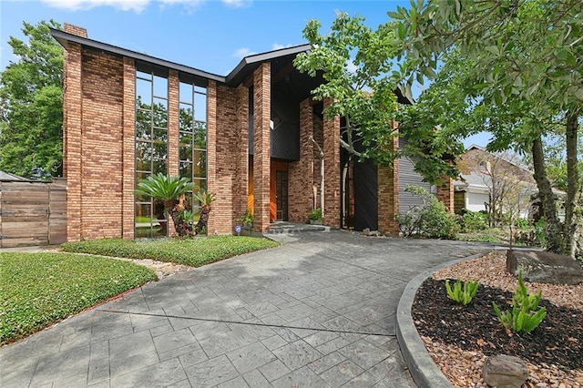 3213 Tolmas Dr, Metairie, LA 70002 - view of front of property with brick siding and a chimney