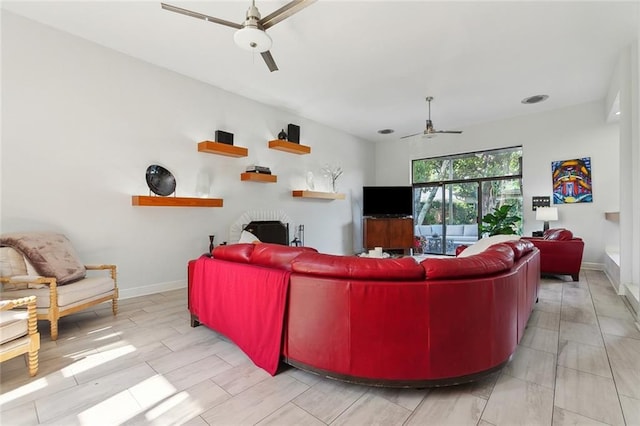 3213 Tolmas Dr, Metairie, LA 70002 - living area with a ceiling fan and baseboards