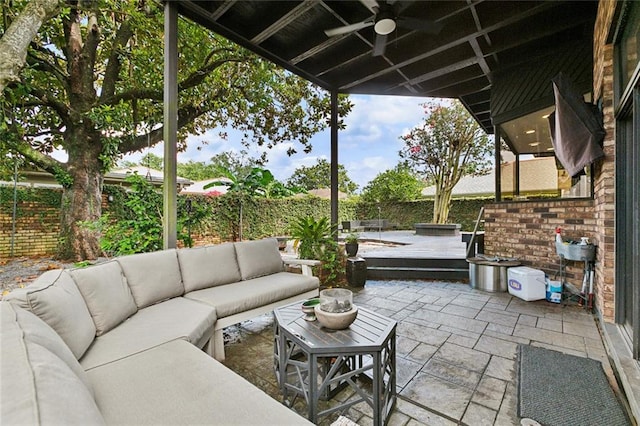 3213 Tolmas Dr, Metairie, LA 70002 - fenced backyard with a ceiling fan, an outdoor hangout area, a wooden deck, and a patio area