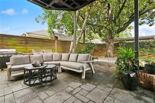 3213 Tolmas Dr, Metairie, LA 70002 - fenced backyard with an outdoor living space, a patio, and area for grilling