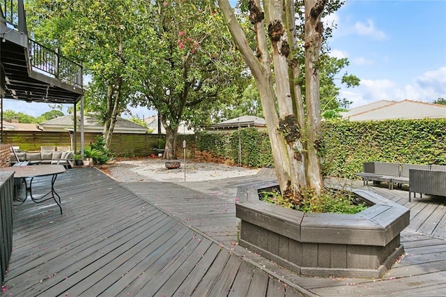 3213 Tolmas Dr, Metairie, LA 70002 - wooden deck featuring a fenced backyard and an outdoor fire pit