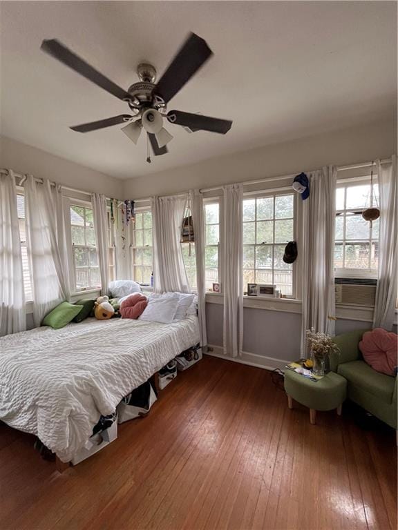 1222 Broadway St, New Orleans, LA 70118 - bedroom with hardwood / wood-style floors, multiple windows, baseboards, and ceiling fan
