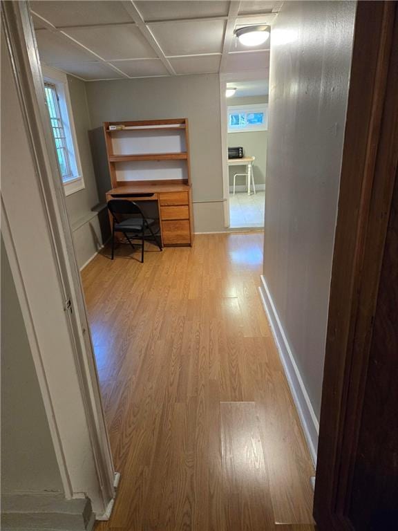 1222 Broadway St, New Orleans, LA 70118 - hallway featuring light wood-type flooring, baseboards, and a desk