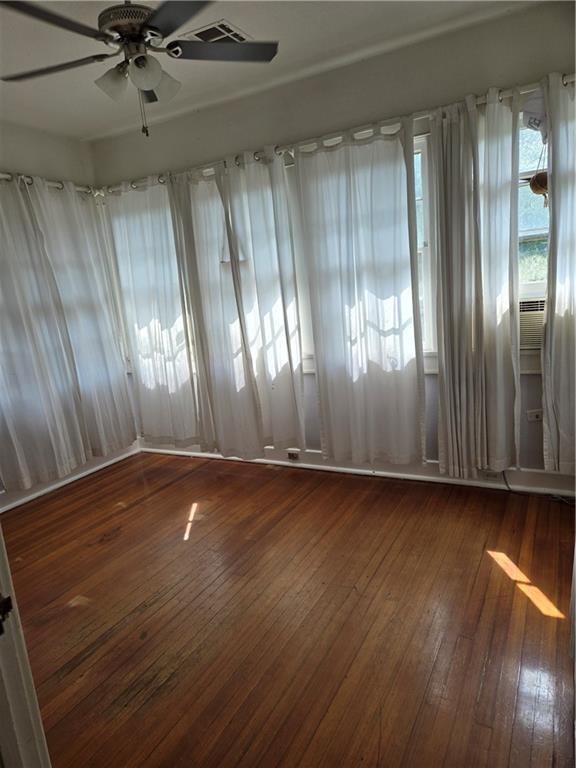1222 Broadway St, New Orleans, LA 70118 - spare room featuring hardwood / wood-style floors and ceiling fan