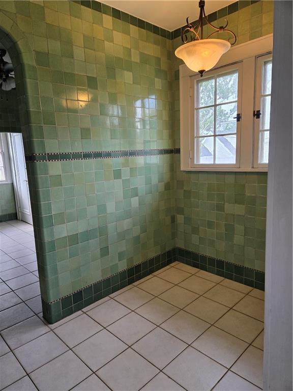 1222 Broadway St, New Orleans, LA 70118 - bathroom featuring tile walls and tile patterned floors