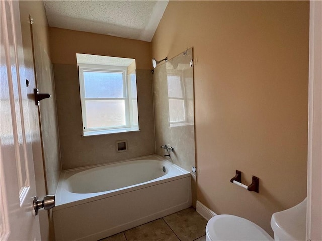 2506 S Sugar Ridge Dr, La Place, LA 70068 - full bathroom with toilet, tile patterned flooring, shower / washtub combination, a textured ceiling, and baseboards