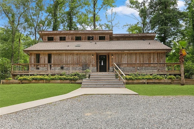 132 Pine Oak Dr, Covington, LA 70433 - view of front facade with board and batten siding, a front yard, and a porch