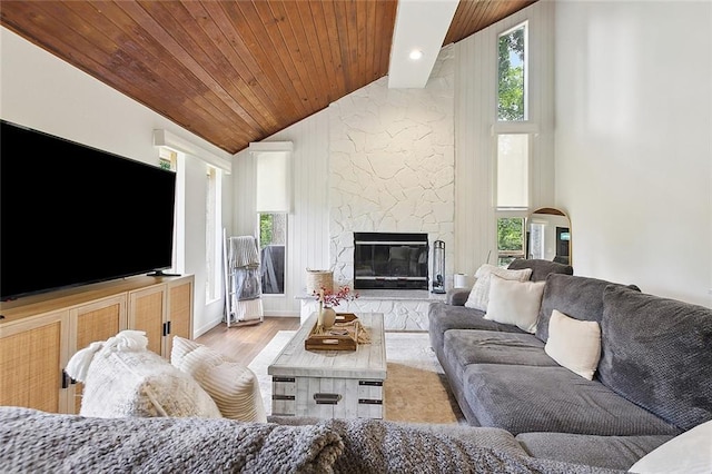 132 Pine Oak Dr, Covington, LA 70433 - living room featuring plenty of natural light, wooden ceiling, wood finished floors, a fireplace, and high vaulted ceiling
