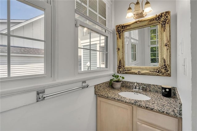 2202 Wirth Pl, New Orleans, LA 70115 - bathroom with vanity and a chandelier