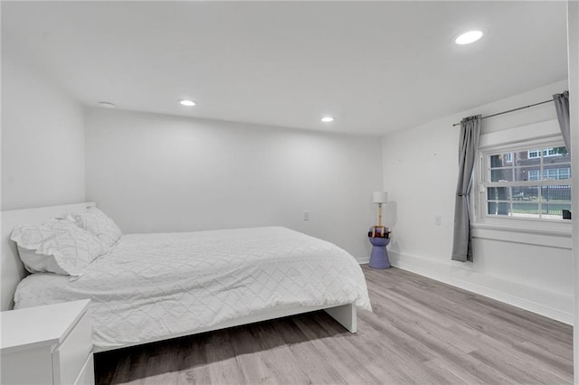 2202 Wirth Pl, New Orleans, LA 70115 - bedroom featuring light wood-style flooring, recessed lighting, and baseboards