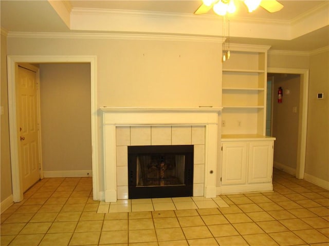 20282 Florence St, Covington, LA 70435 - unfurnished living room with a tile fireplace, ceiling fan, light tile patterned flooring, baseboards, and crown molding