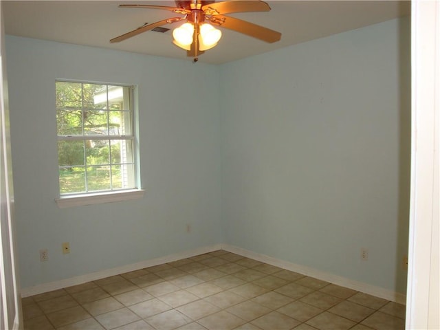 20282 Florence St, Covington, LA 70435 - spare room with ceiling fan, baseboards, and light tile patterned floors