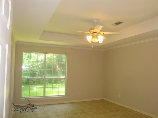 20282 Florence St, Covington, LA 70435 - empty room with a ceiling fan, a raised ceiling, baseboards, and ornamental molding
