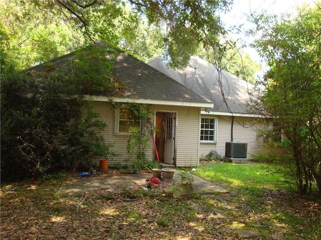 20282 Florence St, Covington, LA 70435 - view of front of home with a shingled roof and central AC unit