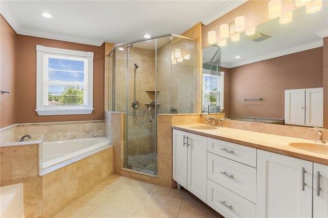 6141 Canal Blvd, New Orleans, LA 70124 - full bathroom with tile patterned floors, double vanity, a garden tub, a shower stall, and crown molding