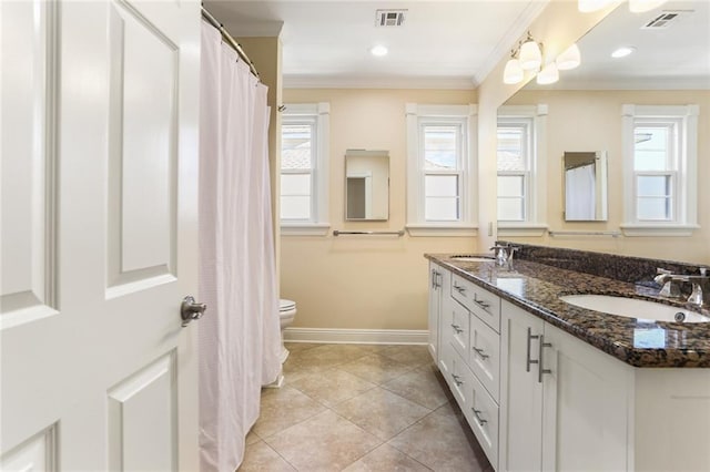 6141 Canal Blvd, New Orleans, LA 70124 - bathroom featuring double vanity, toilet, baseboards, ornamental molding, and tile patterned floors